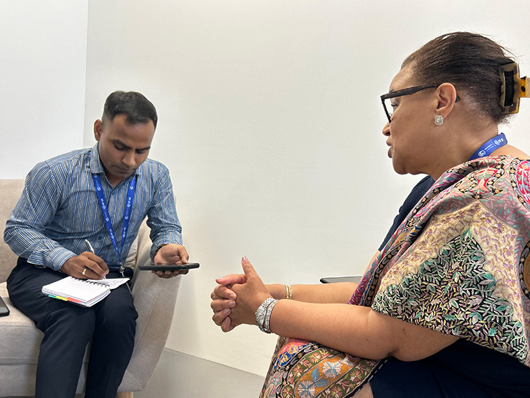 Gaurav Saini, left, does an interview with Commonwealth Secretary-General Patricia Scotland at COP28. (Photo by Devon Terrill)